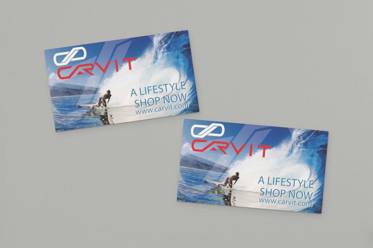 Two Carvit promo cards on a plain gray surface, each with an edge-to-edge photo of a surfer in a breaking wave, the Carvit logo, and 'A lifestyle, shop now' with the web address.